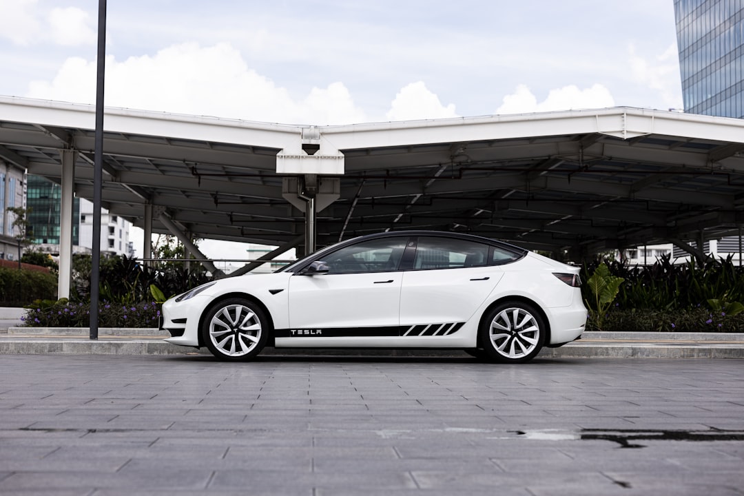 a white car parked outside a building