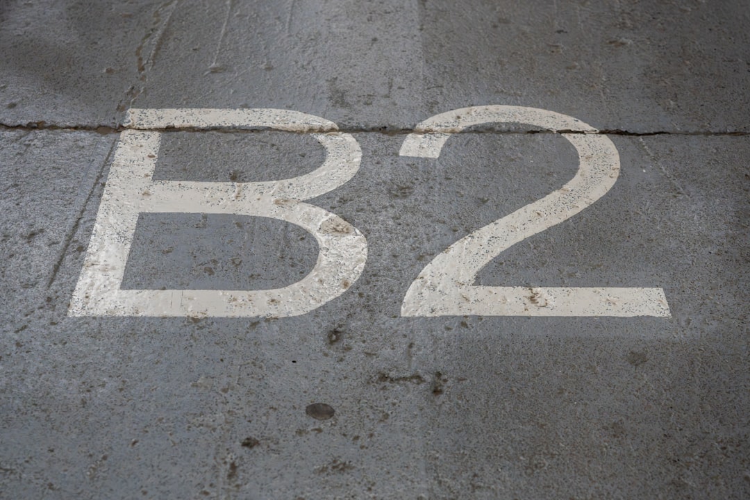 A white b2 sign sitting on top of a sidewalk